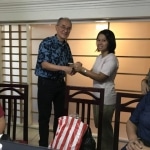 Ma Sa Nyein San accepting MEHS Foundation scholarship award from Dennis Tan